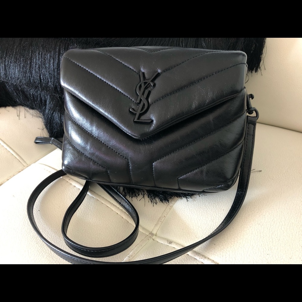 Saint Laurent black on black crossbody handbag.